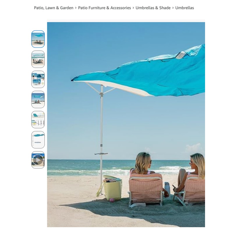 Solbello Shade — beach umbrella set up on sand, shown at scale