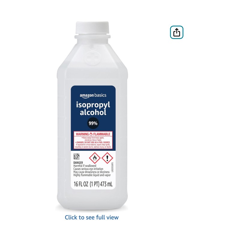 Amazon Basics 99% Isopropyl Alcohol — alcohol bottle on a workshop shelf, shown at scale