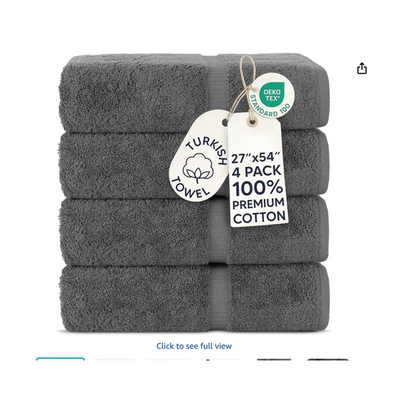 Chakir Turkish Linens Bath Towels — folded towel stack on a shelf, shown at scale